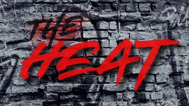 The Heat logo with brick background